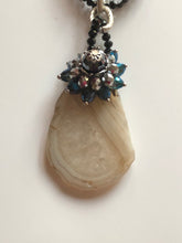 Raw Cut Stone Pendant on Crystal Gemstone Necklace.